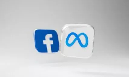 Logos de Facebook et Meta sur un fond gris, illustrant l'article sur l'agence de publicité Facebook.